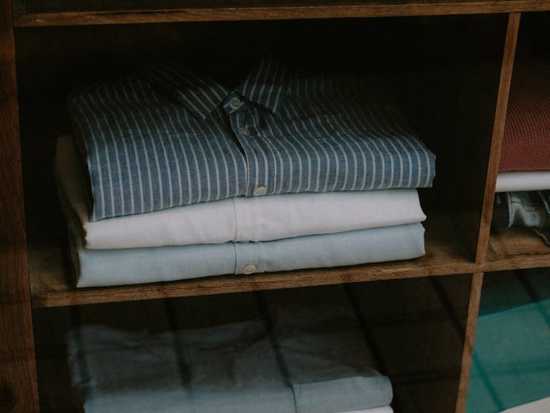 Walk-in closet with custom shelving and organized clothing storage